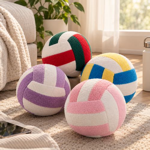 Four VolleyPlush plush volleyballs in pink, purple, yellow/blue, and red/green