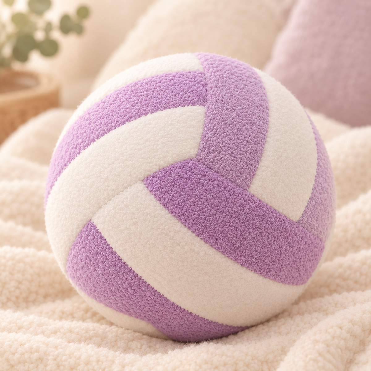 Purple VolleyPlush plush volleyball on a cozy cream blanket